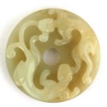 A Chinese jade Bi disc carved with two Chilong to the top and embossed decoration to the