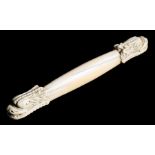 A 19th century Chinese ivory wrist rest with dragon head terminals, 15cms (6ins) long.