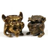A brass grotesque figural match striker; together with a similar inkwell, 7cms (2.25ins) high.