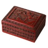 A Chinese rectangular cinnabar lacquer box & cover decorated with a landscape, 14cms (5.5ins) wide.