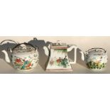 A 19th century Chinese teapot of square tapering form decorated with figures in a landscape,