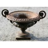 A cast iron two-handled planter, 39cms (15.25ins) diameter.