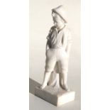 An alabaster figure depicting a young boy wearing shorts, 13cms (12.5ins) high.