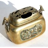 A Japanese Meiji period bronze hand warmer with pierced cover and bird motif handles, 16cms (6.