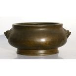 A Chinese bronze censer with two mythical beast handles, six character mark to underside, 19cms (7.