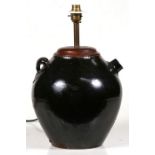 A Chinese glazed wine pot (converted to a table lamp), 27cms (10.5ins) high.