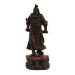 A Chinese rootwood figure depicting a warrior, 51cms (20ins) high.