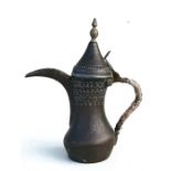 A Turkish / Islamic dallah coffee pot, 39.5cms (15.5ins) high.