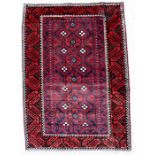 A handmade Persian Baluch rug with geometric design on a red ground, 220 by 125cms (86.5 by 49.