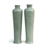 A pair of Chinese celadon crackle glazed vases of cylindrical tapering form, 29cms (11.5ins) high.
