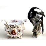 A continental porcelain group depicting a magpie perched on a tree stump watching a snail, 28ins (