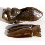 Two Chinese hardstone carvings in the form of Cicadas, 8cms (3.2ins) and 6cms (2.25ins) long.