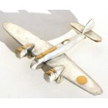 A chrome plated brass model of the WW2 light bomber the Bristol Blenheim standing on its