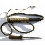 A camel whip with concealed stiletto dagger in the handle