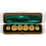 A boxed set of gilt London Badge & Button Co.hunting buttons decorated a lurcher