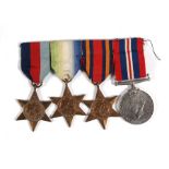 A mounted WW2 medal group consisting of the 39/45 Star, Atlantic Star, Burma Star and the War Medal