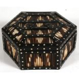 An Anglo-Indian hexagonal porcupine quill & ebony casket, 21cms (8.25ins) wide.