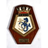 A hand painted presentation ships crest or plaque mounted on a wooden shield to the Royal Maritime