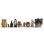 A collection of various owl figures to include a pewter pepper pot, a Parian ware long eared owl, an