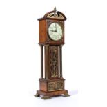 A miniature oak cased longcase clock, the painted enamel dial with Arabic numerals, the case with