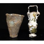 Antiquities. A Roman glass balsarium, 15cms (6ins) high; together with an early Eastern glass cup,