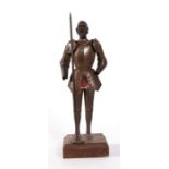 A patinated metal figure of Don Quixote 36cms (14ins) high.