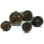 A group of five mahogany and brass fishing reels.