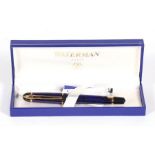 A Waterman fountain pen with blue marble effect body, boxed, 13cms (5ins) long.
