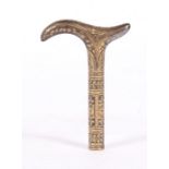 A Toledo style steel and yellow metal inlaid walking stick handle, 10cms (4ins) high.