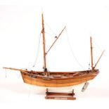 A scratch built model of a boat, 46cms (18ins) long.