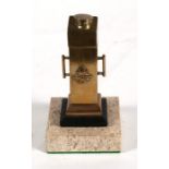 An unusual brass WW2 Royal Air Force table lighter mounted on a marble base. Having a miniature