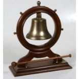 A late 19th / early 20th century ship's wheel & bell dinner gong, 35cms (13.75ins) high.