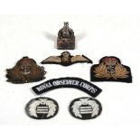 A group of RAF & Naval cloth badges; together with a silver plated menu stand.