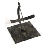 An antique bronze & spelter sun dial with engraved decoration, 21cms (8.25ins) high.