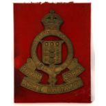 An impressive WW2 period bronze gate badge to the Royal Army Ordnance Corps mounted on a cloth