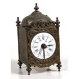 A brass lantern clock, the white enamel dial with Roman numerals, 14cms (5.5ins) high.