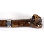 A Victorian sword stick, the handle carved in the form of a dog's head, with glass eyes, 84cms (