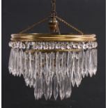 A three-tier ceiling light with crystal drops, 26cms (10.25ins) diameter.
