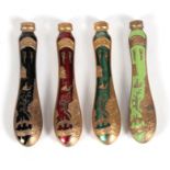 Four gilt metal and enamel chinoiserie cutlery handles, 10.5cms (4.1ins) long.