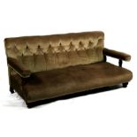 A Howard & Son's Country House open armed low sofa with button back, on turned front supports, the
