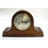 An Edwardian inlaid mahogany cased mantle clock, the silvered dial with Arabic numerals, 41.9cms (