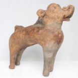 Antiquities. A Persian / Asiatic terracotta figure of an elephant and rider, 19cms (7.5ins) high.