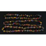 Four large strings of Venetian multi coloured bead necklaces (4).