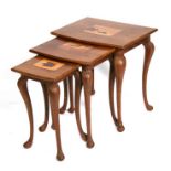 A palm wood nest of three tables with inlaid panels depicting a sailing ship, a bird and a turtle,