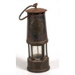 A Protector Lamp and Lighting Co. type 'SL' miner's lamp, 29cms (9.75ins) high.
