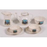 A seven-piece Goss crested china tea-set bearing the crest of the Island of St Helena.