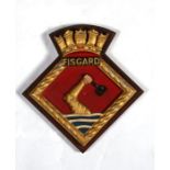 A hand painted aluminium ships crest or plaque mounted on a wooden shield to HMS Fisgard. Overall