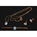 A 9ct gold opal set bar brooch; together with a 10ct gold mounted opal pendant on a 9ct gold