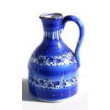A 19th century Delft jug, 14cms (5.5ins) high.