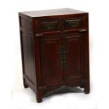 A Chinese lacquered wood cupboard with two short drawers above a pair of cupboard doors, 50cms (19.